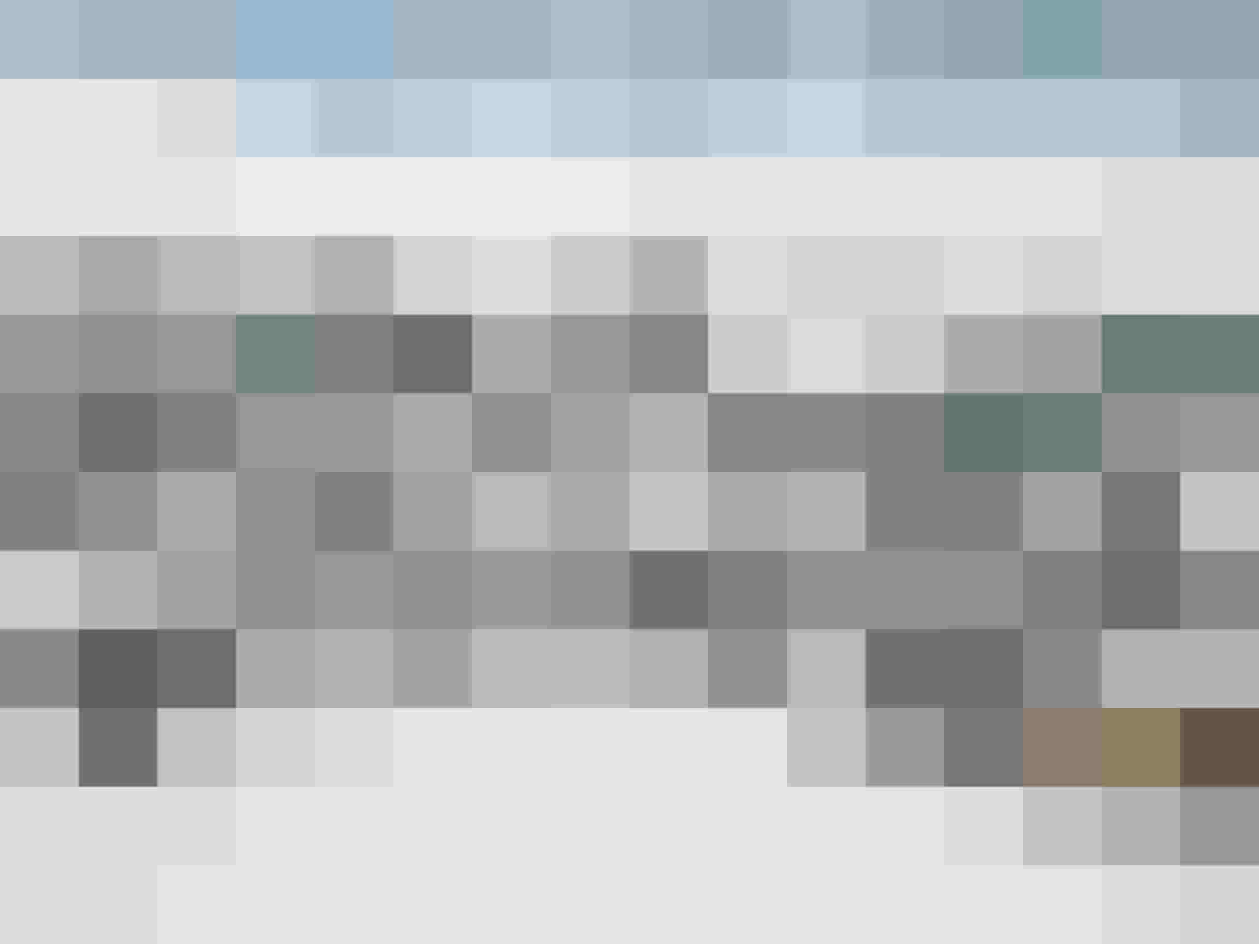 Snow-covered Alpine Town of Mittersill with Traditional Houses and Mountain Panorama in Winter